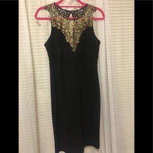 Black cocktail dress with gold filigree